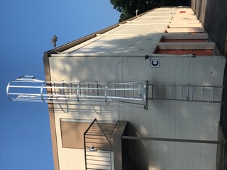 Galvanized roof access ladder with safety cage