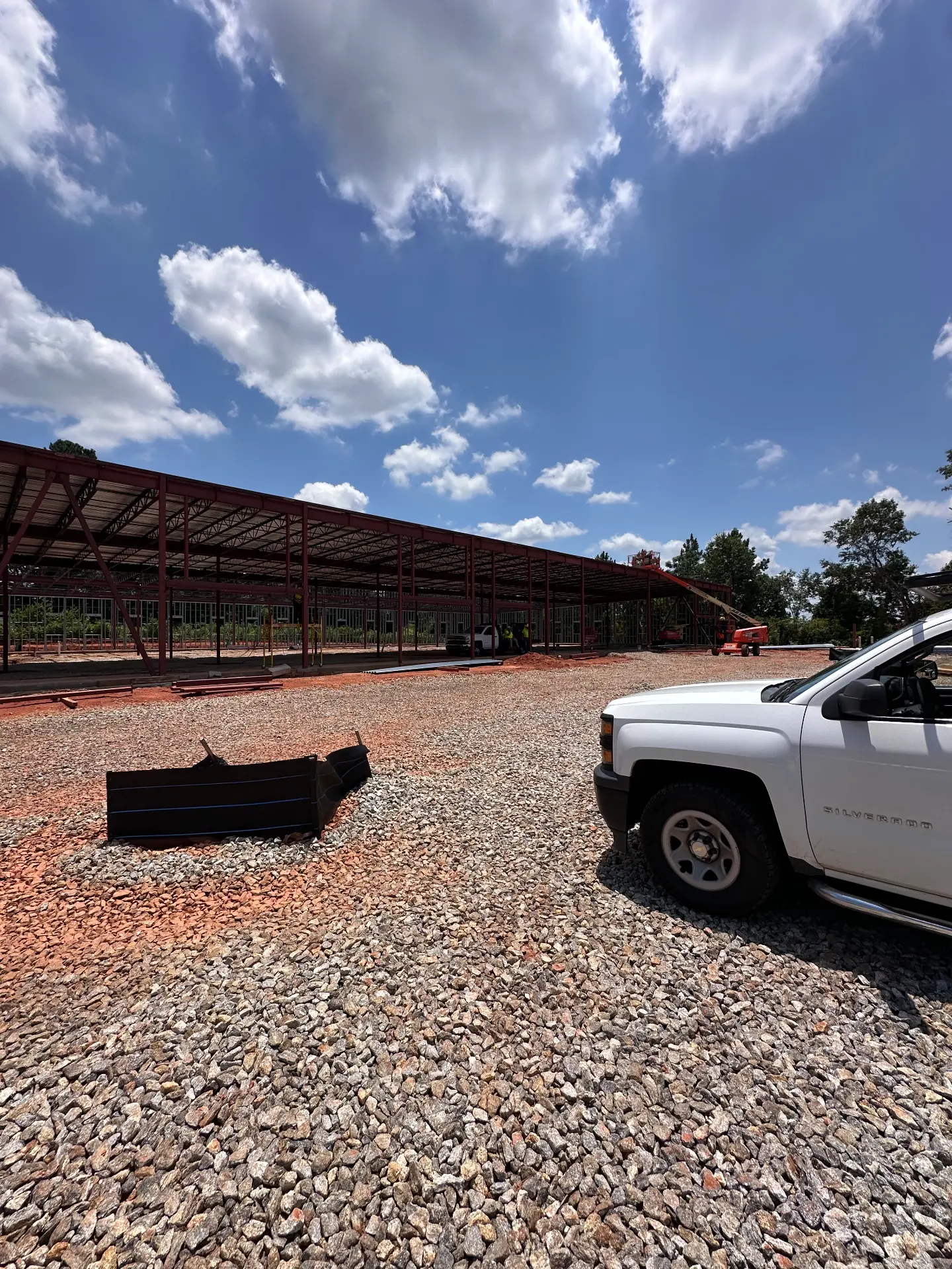 Red structural steel frame for a commercial warehouse