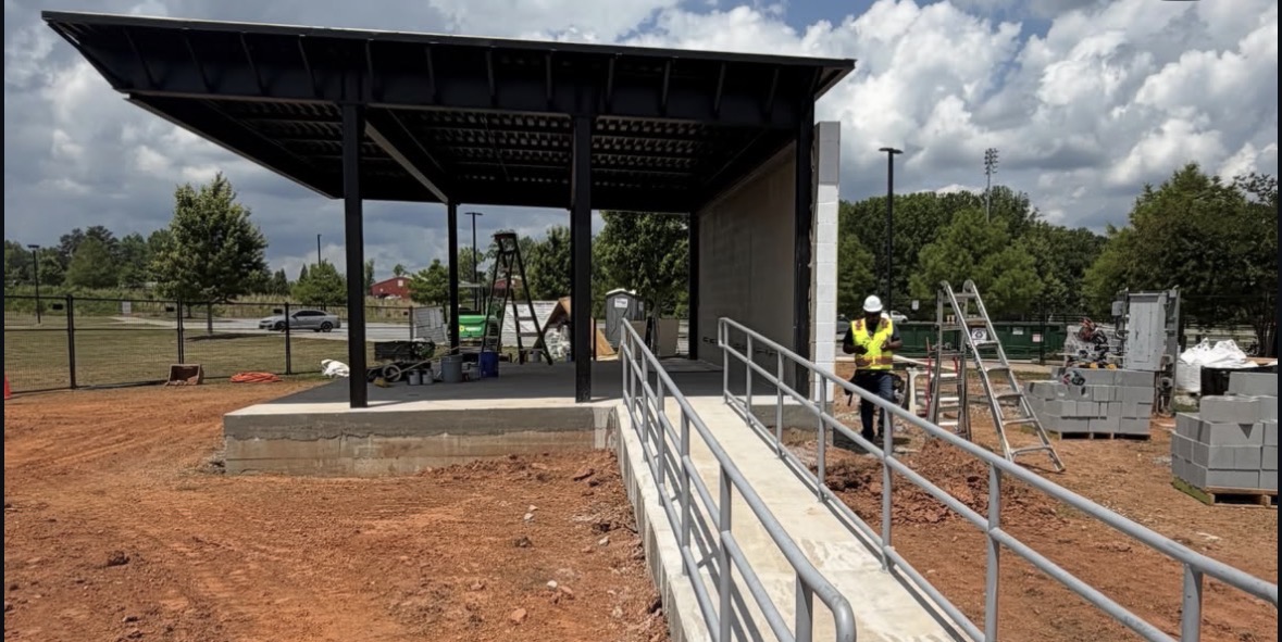 Completed black steel canopy on a concrete pad