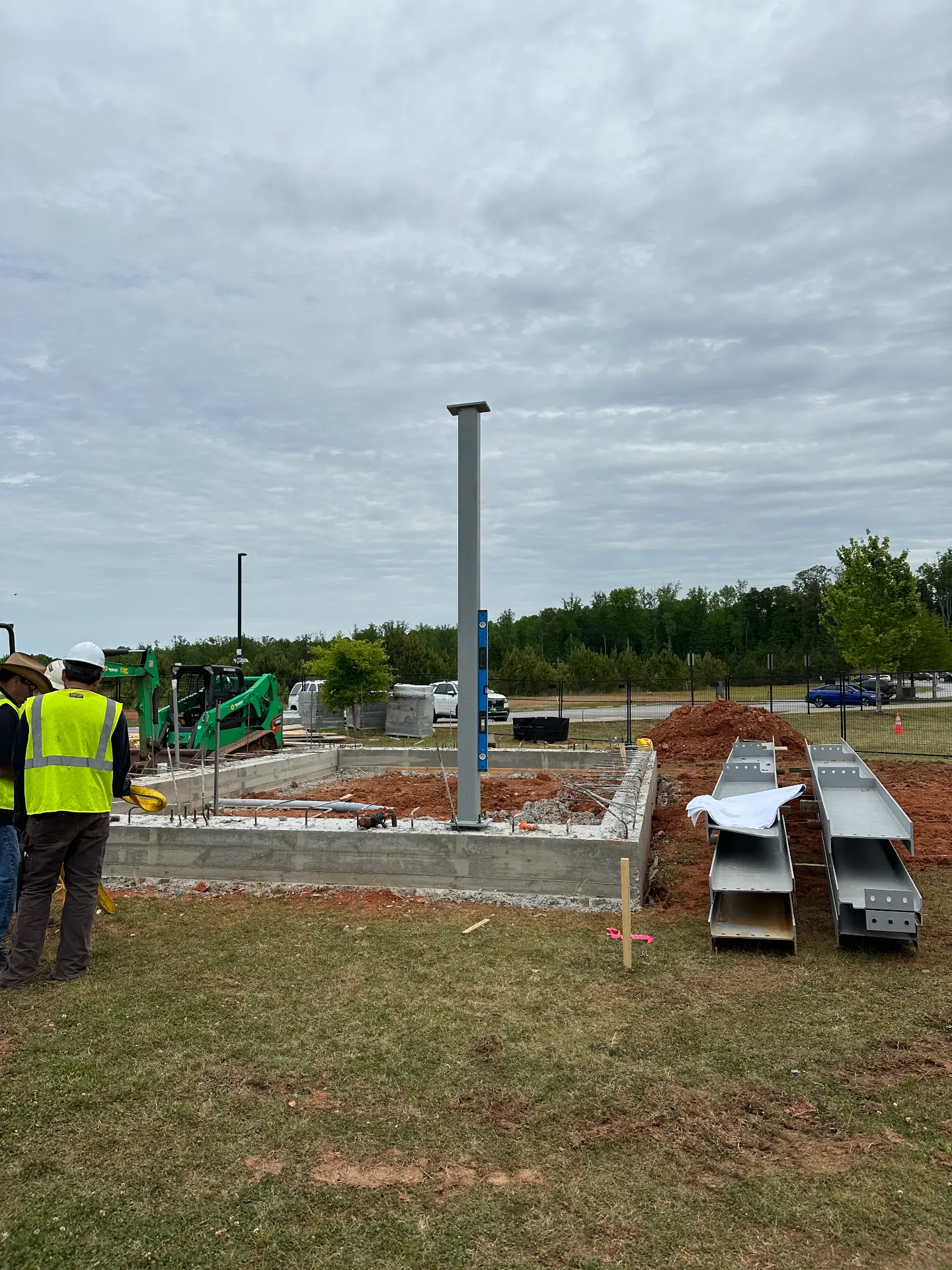 Steel column anchored to a new concrete foundation