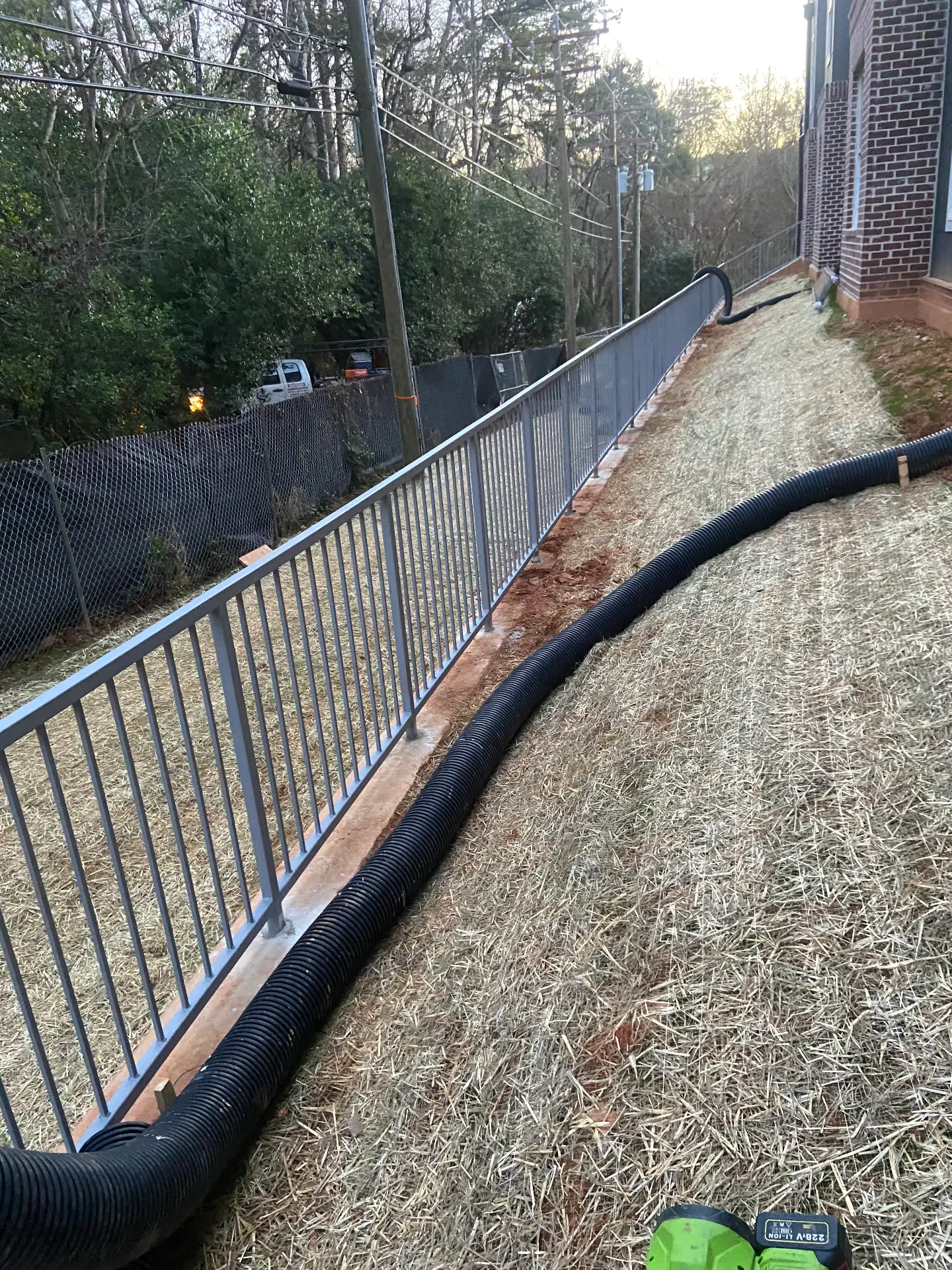 Long steel guardrail run at a modern apartment building