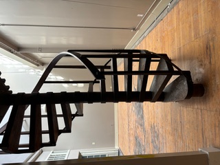 Fabricated steel spiral stair with wood treads