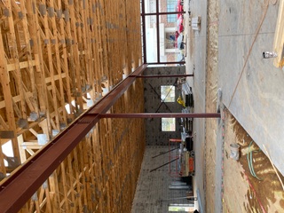 Interior red steel beams and columns on a commercial build