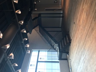 Black steel interior stair in a renovated commercial space