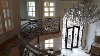 Ornamental curved iron balcony railing in a residence
